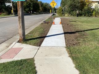 New sidewalk and bike route signs.
