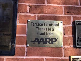 Sign "Terrace Furnished Thanks to a Grant from AARP"