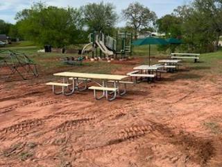 Picnic tables adjacent to playground.