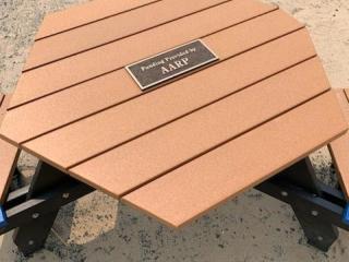 New accessible picnic table with plaque.