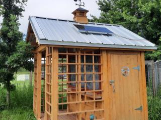 Solar panel for lights on shed roof.