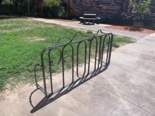 New bike rack with picnic table in background