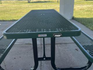 New picnic table with plaque.