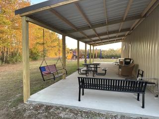 New covered picnic area, tables, and children's playground.