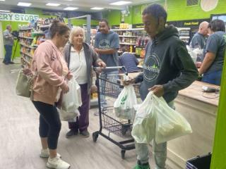 Shoppers using grocery store.