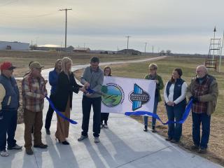 Ribbon cutting event for new walking path.