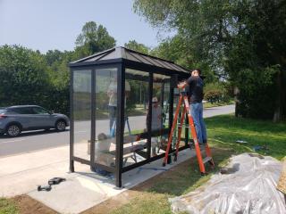 Installing new accessible bus shelter.