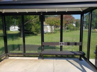 New accessible bus shelter with solar power, led lights, USB charging port, and bench.