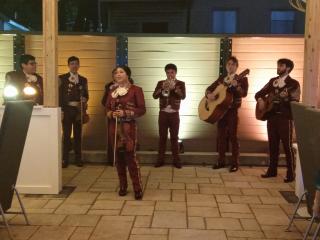 Musicians performing at opening night of La Plazita covered outdoor area.