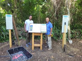 Volunteers installing new trail signs.