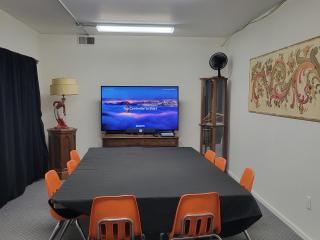 New conference table and flat screen tv.