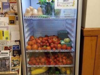 Refrigerator case of free fresh produce.