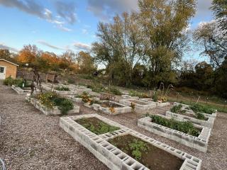 Community garden with raised garden beds made of cinderblocks.