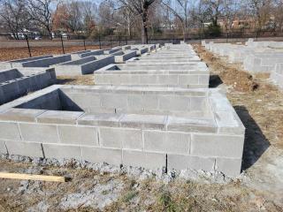 Raised garden beds made of concrete blocks.