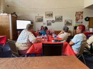 Older adults attending "Fraud Watch" educational event.
