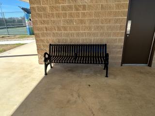 New bench near tennis courts.