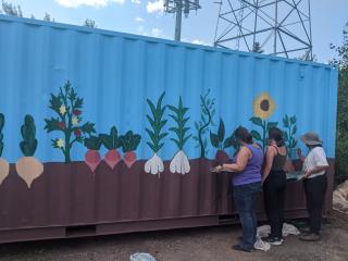 Painting  flower mural on shipping container