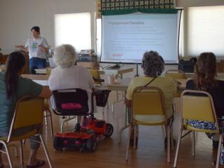 Community meeting with older adults.