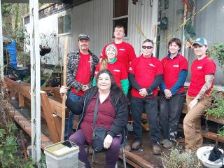 Volunteers with homeowner.