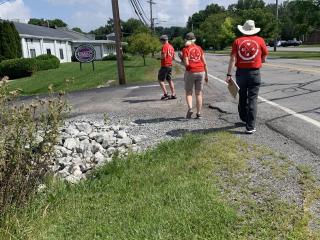 Volunteers doing walk audit along side of road with no shoulder.