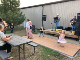 Small dance floor in front of musical stage.