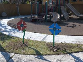 Completed playground with new fence and musical flowers.