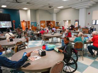 Group of older adults attending a digital literacy class.