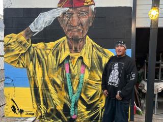 Mural of Navajo Code Talker with artist Ivan Lee.