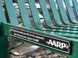 Sign on bench.