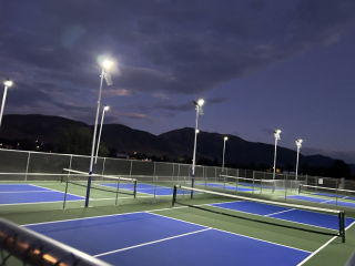 Pickleball courts at night.