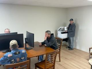 Veterans using computers and printers.