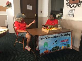 Volunteers recruiting intergenerational gardeners.