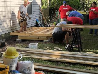 Volunteers helping with home repairs.