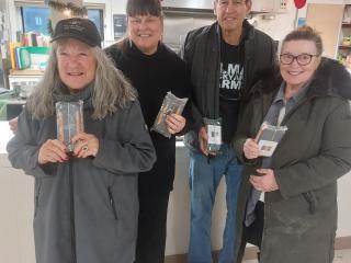Community members with solar chargers.