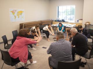 Caregivers performing chair exercises.