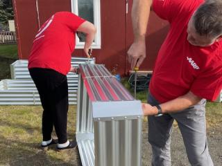 Assembling raised garden beds.