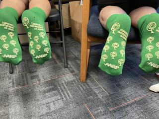 Nonslip socks with AARP and Community Partnership on Aging logos.