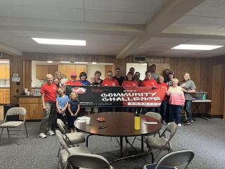 Church members with thank you banner.