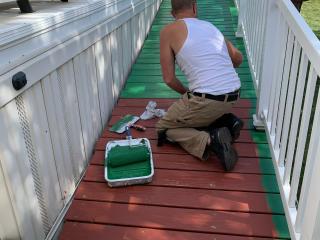 Painting new ramp to home entrance.