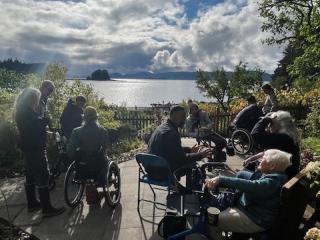 Adults in wheelchairs enjoying the view from the new path.