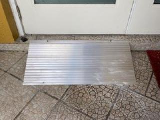 New metal ramp at doorway entrance.