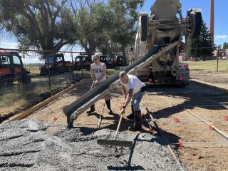 Pouring concrete for accessible garden paths.