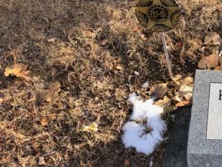 Example of veteran marker placed near gravesites