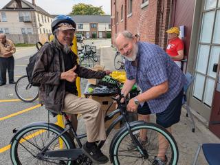 Adjusting bike for an older adult.