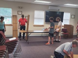 Volunteers assembling raised garden beds.