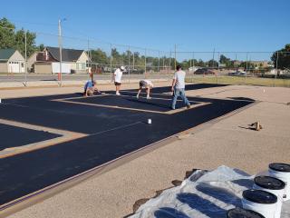 Painting the pickleball court.