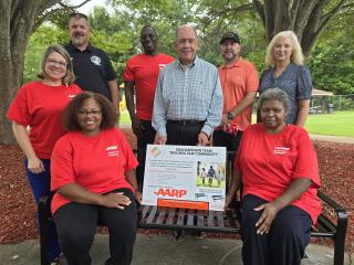 Group photo next to new bench