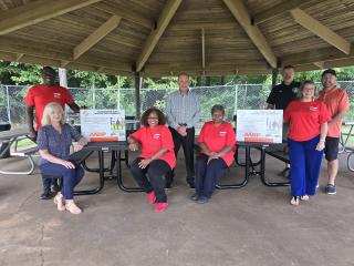 Group photo next to new picnic tables.