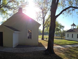 Panoramic view of historic buildings and new sidewalk.