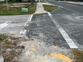 Crosswalk with worn paint.